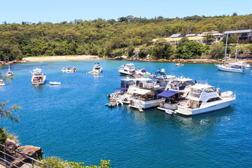 Obraz premium Boats moored in te bay of Collins Flat beach