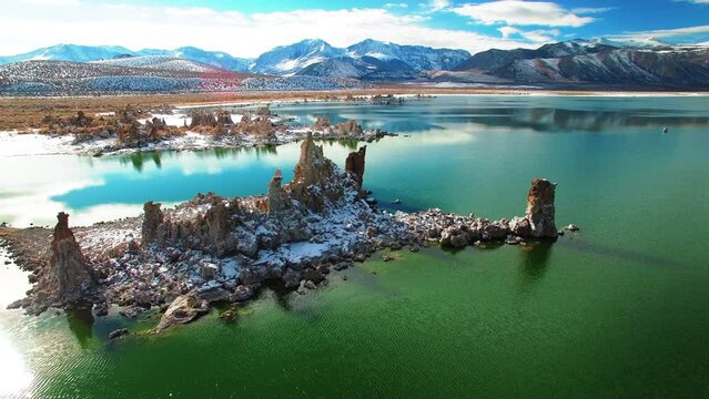 Aerial Panning Beautiful View Of Snowy Mountains, Drone Flying Over Rippled Mono Lake - June Lake, California