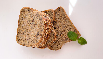 Wholemeal grain loaf sliced bread isolated on white background. 