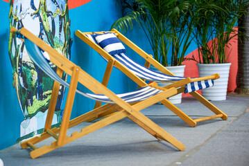 Close-up of leisure beach chairs placed in a relaxing hotel