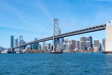 Fototapeta na wymiar The Oakland Bay Bridge and the downtown San Francisco skyline as viewed from the San Francisco Bay.