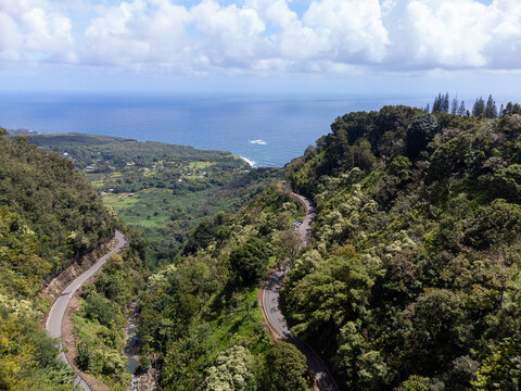 An aerial photo of the Road To Hana and the Pacific Ocean in Maui, Hawaii. 