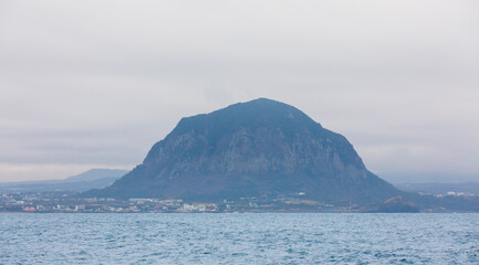 Fototapeta premium Island scenery seen from the sea on a cloudy day.