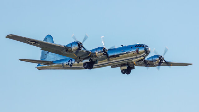 close up of B-29 bomber Doc with gear in the process of retracting shortly after takeoff