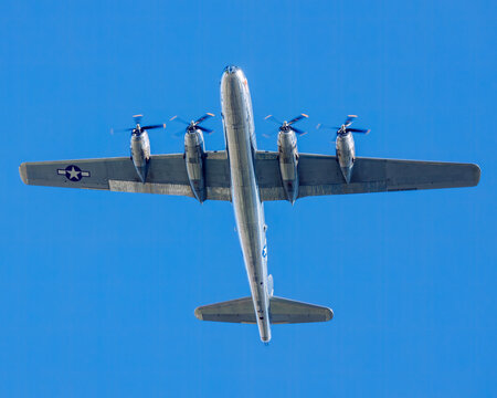 underside of B-29 bomber Doc as it makes a low pass on a sunny day