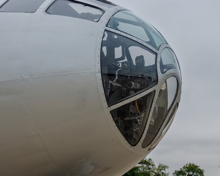 close up of nose of B-29 bomber on a cloudy day