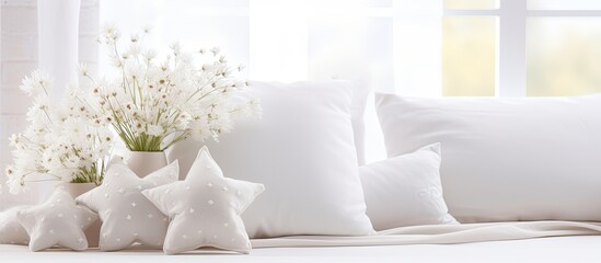 There are three pillows and a vase with flowers on a bed - Powered by Adobe