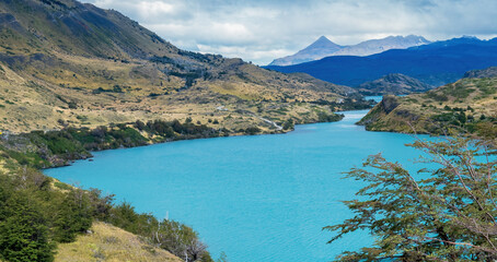 Scenic Turquoise Lake Surrounded by Rugged Mountains