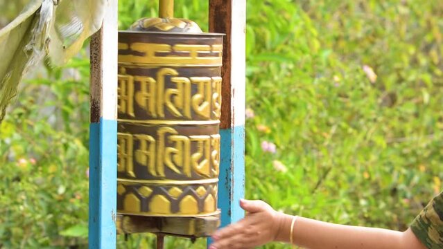 Buddhist religious prayer wheels with Buddhist mantra flags near Buxa Fort Alipurduar.