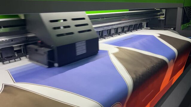 Industrial sublimation printer for digital printing on fabrics. Textile printing is the process of applying colour to fabric in definite patterns or designs