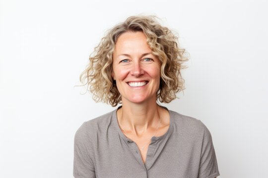 Portrait of a smiling middle-aged woman on a white background