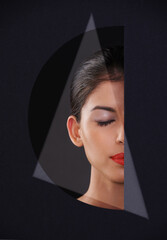 Young, woman and cosmetics or beauty in cutout for makeup, skincare and dermatology. Model or person with eyes closed and dreaming of foundation in geometric, mockup and a dark or black background