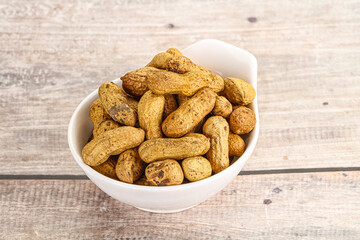 Raw ripe unpeeled peanut heap