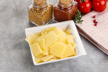 Sliced parmesan cheese in the bowl