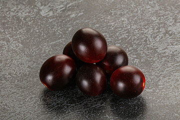 Raw ripe black kumato tomato