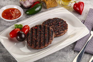 Grilled burger cutlet with sauce