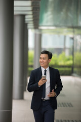 Chinese business man in modern Asian city