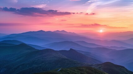 The image captures a stunning sunset with vibrant hues of pink, purple, and blue cascading over multiple mountain ranges, creating a tranquil atmosphere