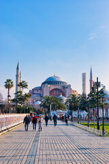 Fototapeta na wymiar Istanbul, Turkey - March 21, 2024: Editorial: Hagia Sophia mosque in the morning against blue sky in spring in Istanbul, Turkey