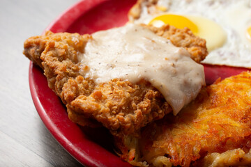 A closeup view of a country fried steak plate.