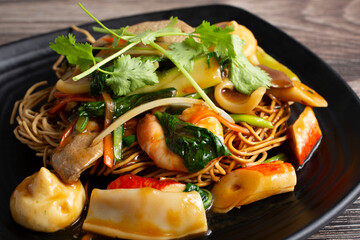 A closeup view of a fried crispy noodles plate. © DAVID