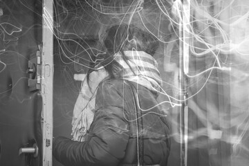 Woman wearing a shawl, in the doorway leaving the flat. Black and white. Tangled abstract lines. Collage.