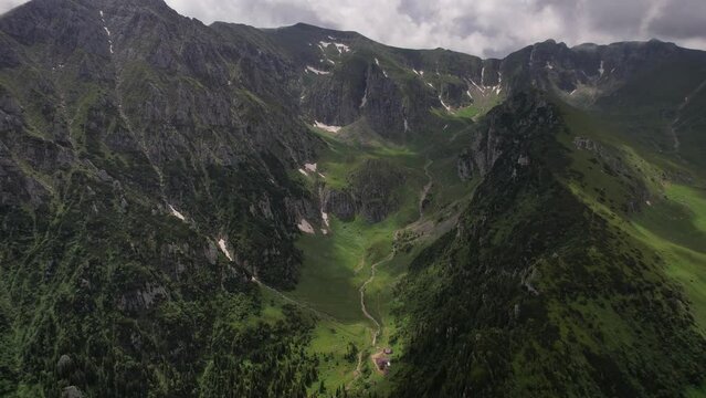 The lush bucegi mountains with dramatic valleys and peaks, summer, aerial view