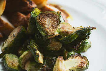 A closeup view of a portion of roasted Brussels sprouts.