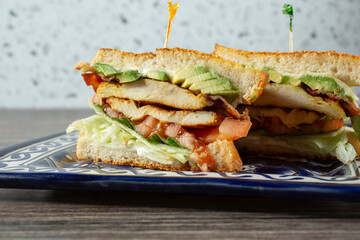 A view of a chicken club sandwich.