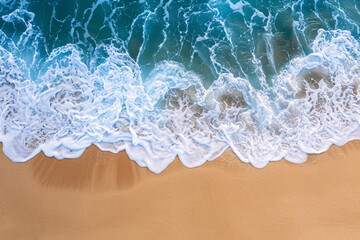 Fototapeta na wymiar summer background - aerial view of sea waves on tropical beach
