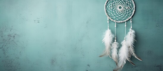 Capture a detailed view of a decorative dream catcher displayed on a wall in a close-up shot - obrazy, fototapety, plakaty