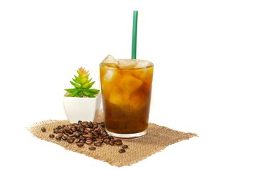 Americano ice coffee,coffee grounds put around the glass ready for drink,Americano ice coffee put on white background for copy space.