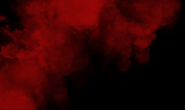 Red smoke on black background