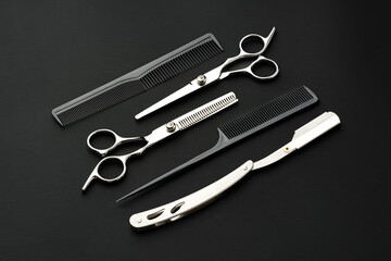 Tools for barbershop on black background studio shot