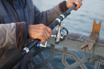 Fisherman with rod, spinning reel ,