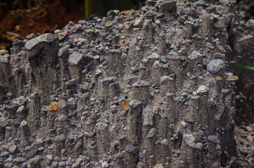 zoom photo of piles of black sand