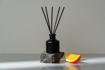 Aromatic Reed Diffuser on a Stone Base With Orange Slice Accent