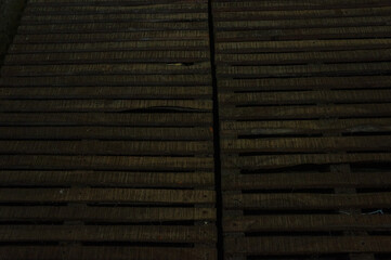 the texture of the pallets from dark brown wood