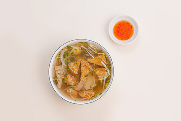 Banh canh cha ca Nha Trang, Rice noodles soup with fish cake from Nha Trang , Vietnamese food isolated on white background, top view