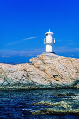 Lighthouse on a rocky coastline