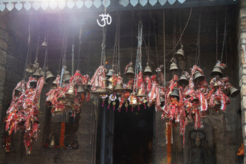 many bells hanging outside hindu temple
