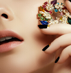 Black matte nail polish. Manicured nail with black matte nail polish. Manicure with dark nailpolish. Golden nail art manicure