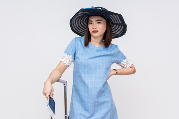Upset Asian female tourist in blue dress isolated on white