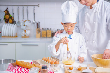 father and son cooking