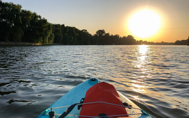 paddle board on a lake on a sunny day 