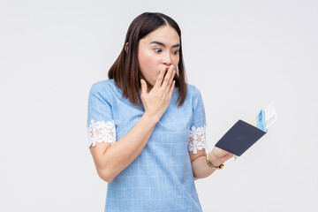 Asian woman shocked to discover her passport is expired, on white background - obrazy, fototapety, plakaty