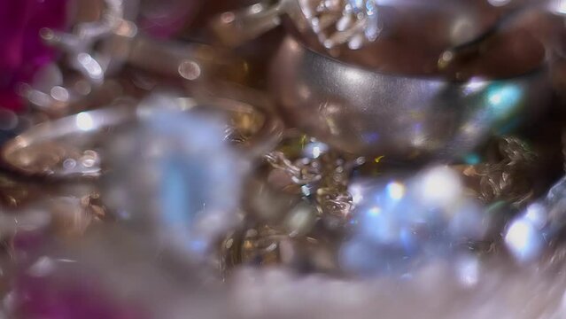 Beautiful shiny, sparkling golden jewelry with glare in gems. Macro. Closeup. Shallow depth of field