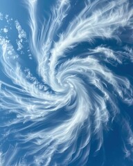 Wispy white clouds swirling together to create a mesmerizing vortex in the clear blue sky