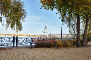 Rest area with bench on the river embankment in Kyiv, Europe. Place to rest in the city park