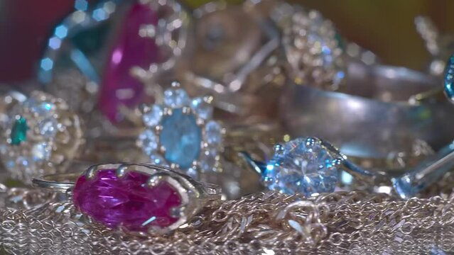 Beautiful shiny, sparkling golden jewelry with glare in gems. Macro. Closeup. Shallow depth of field